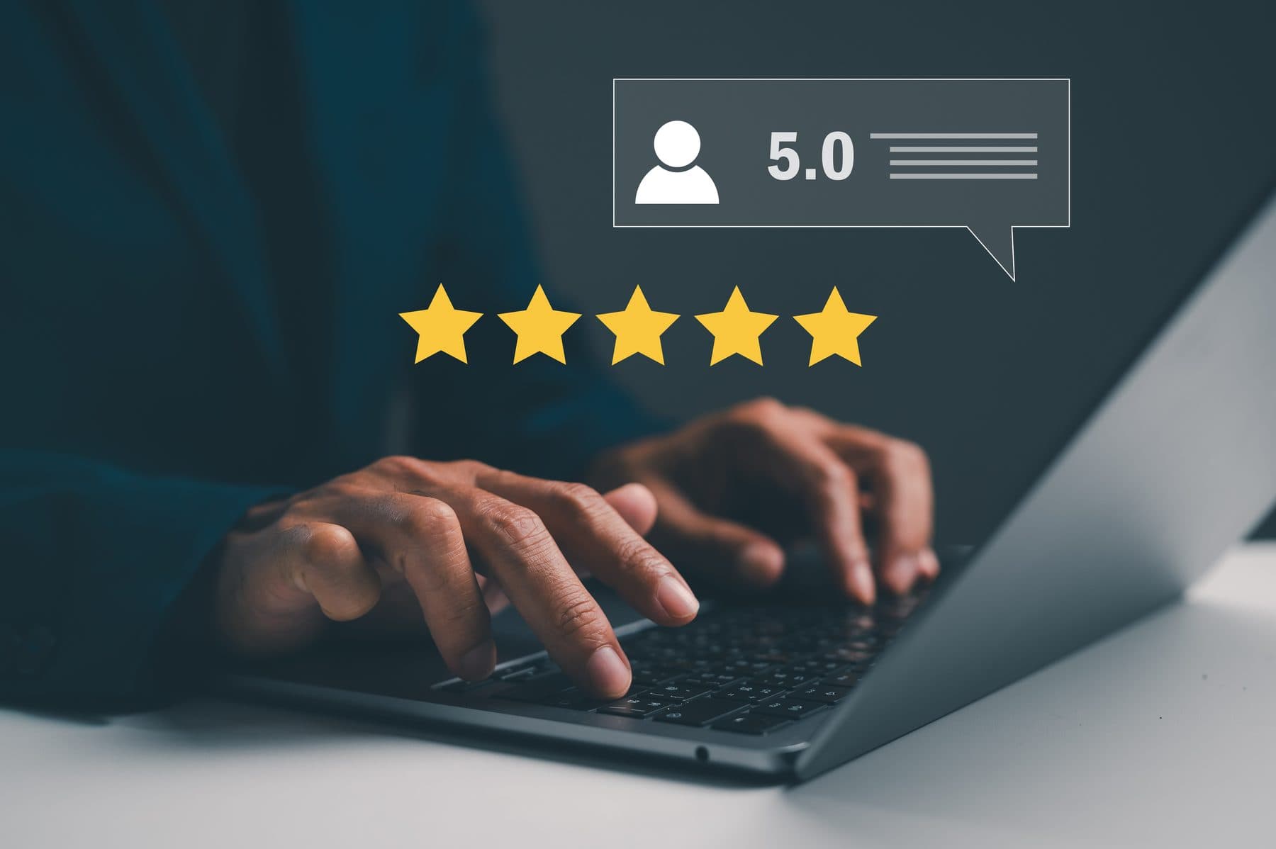 Hands typing on a laptop with a five-star review rating shown alongside